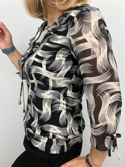 ANDREA ruffle top