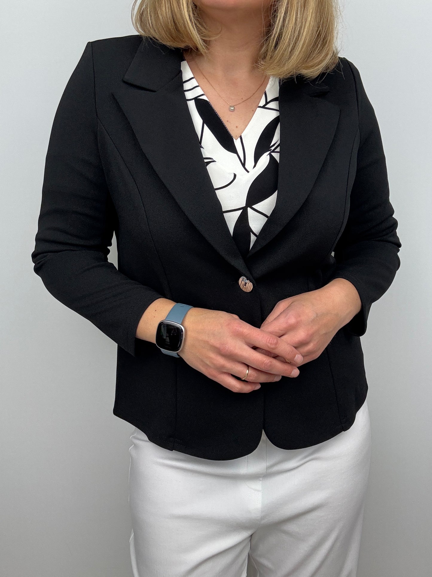 Black fabric jacket with lapel collar