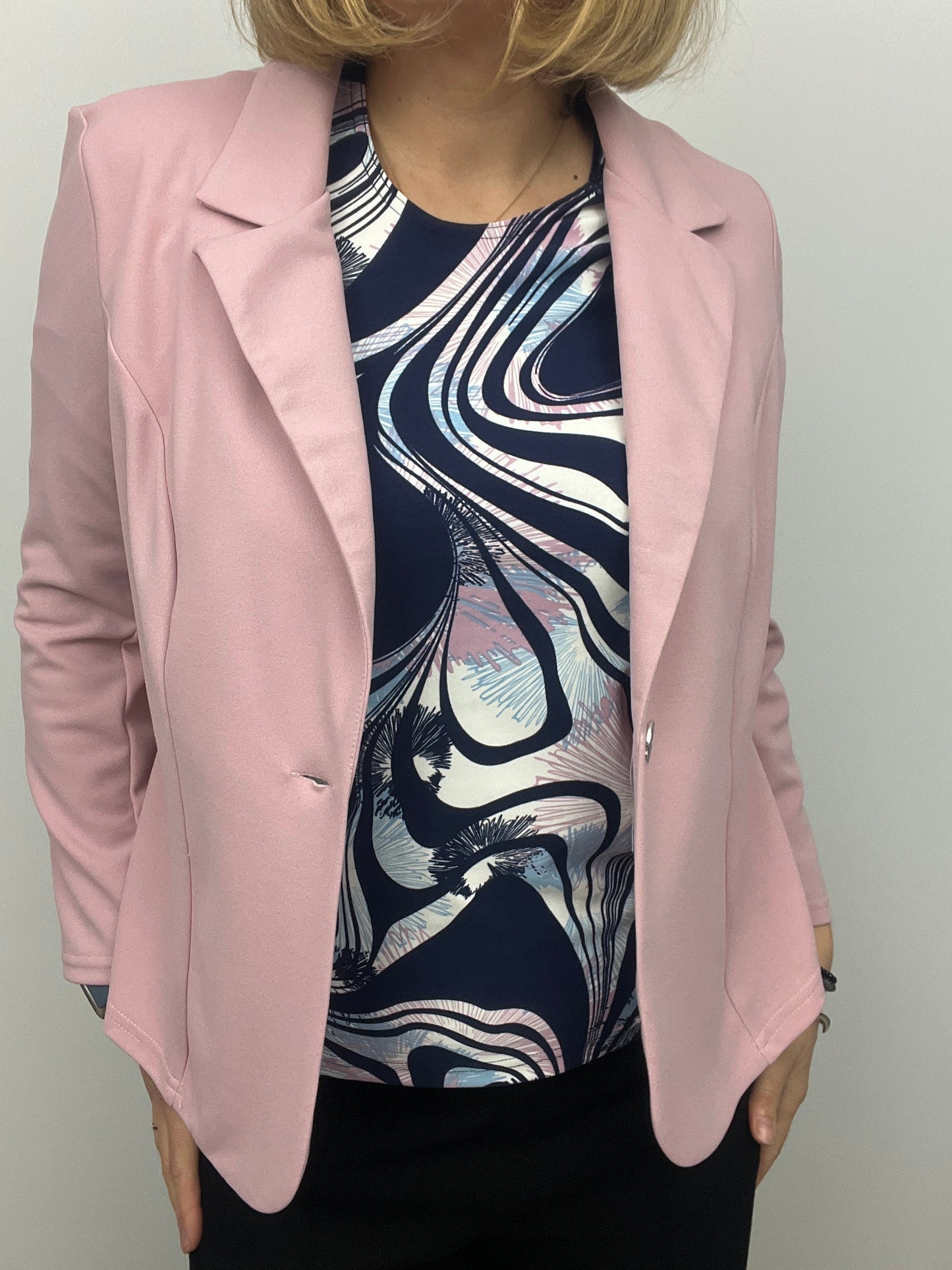 Soft pink fabric jacket with lapel collar