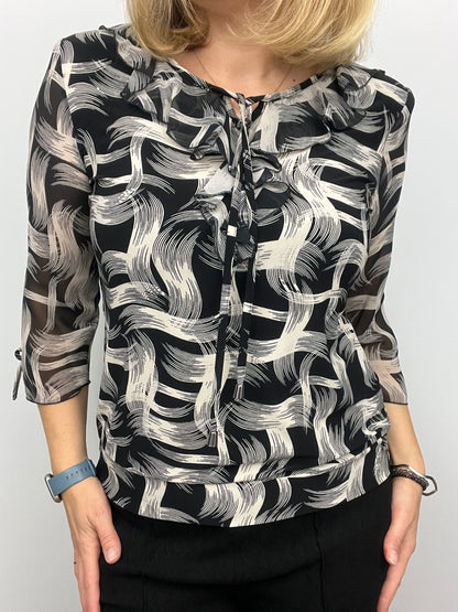 ANDREA ruffle top