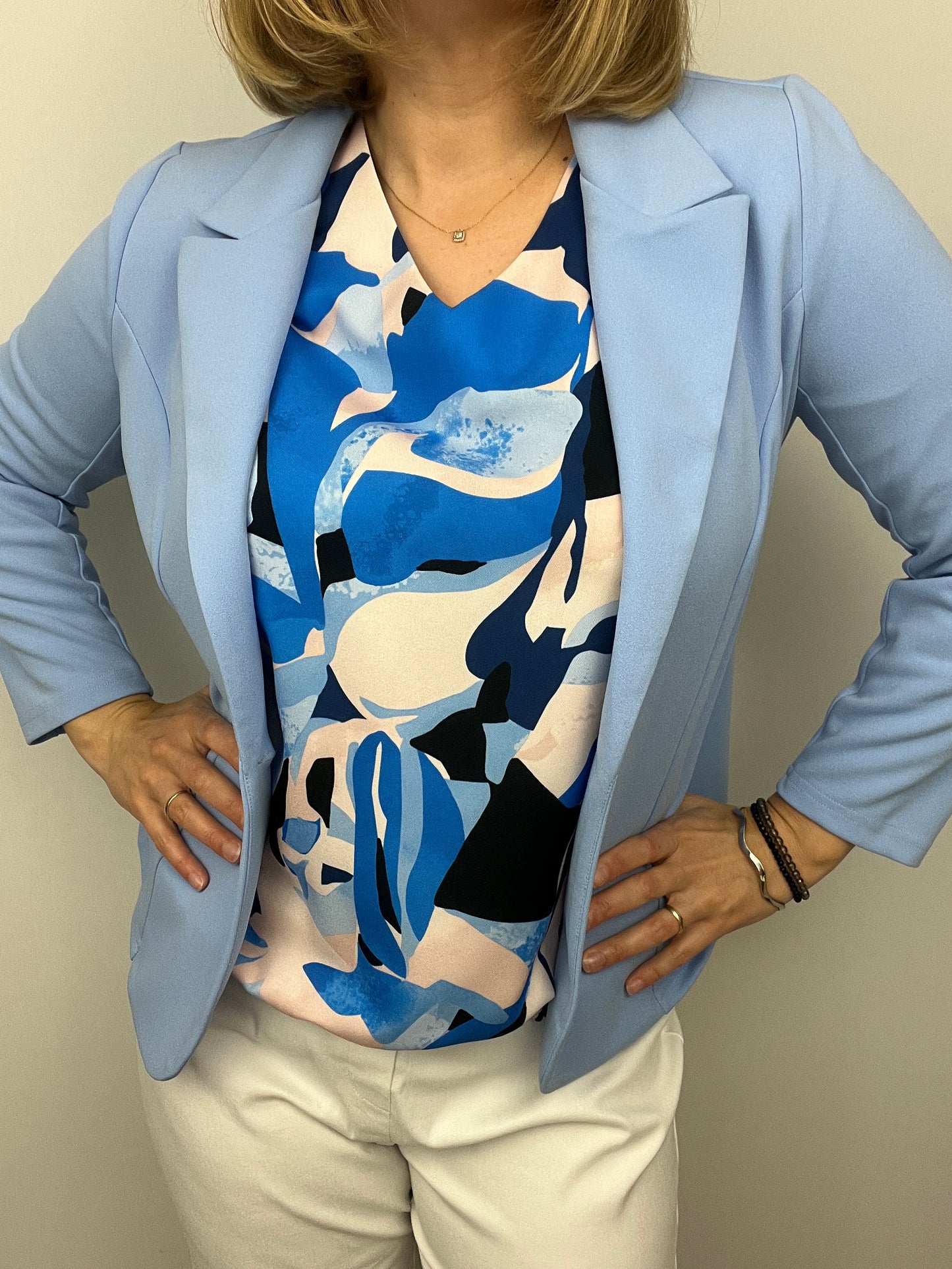 Soft blue fabric jacket with lapel collar