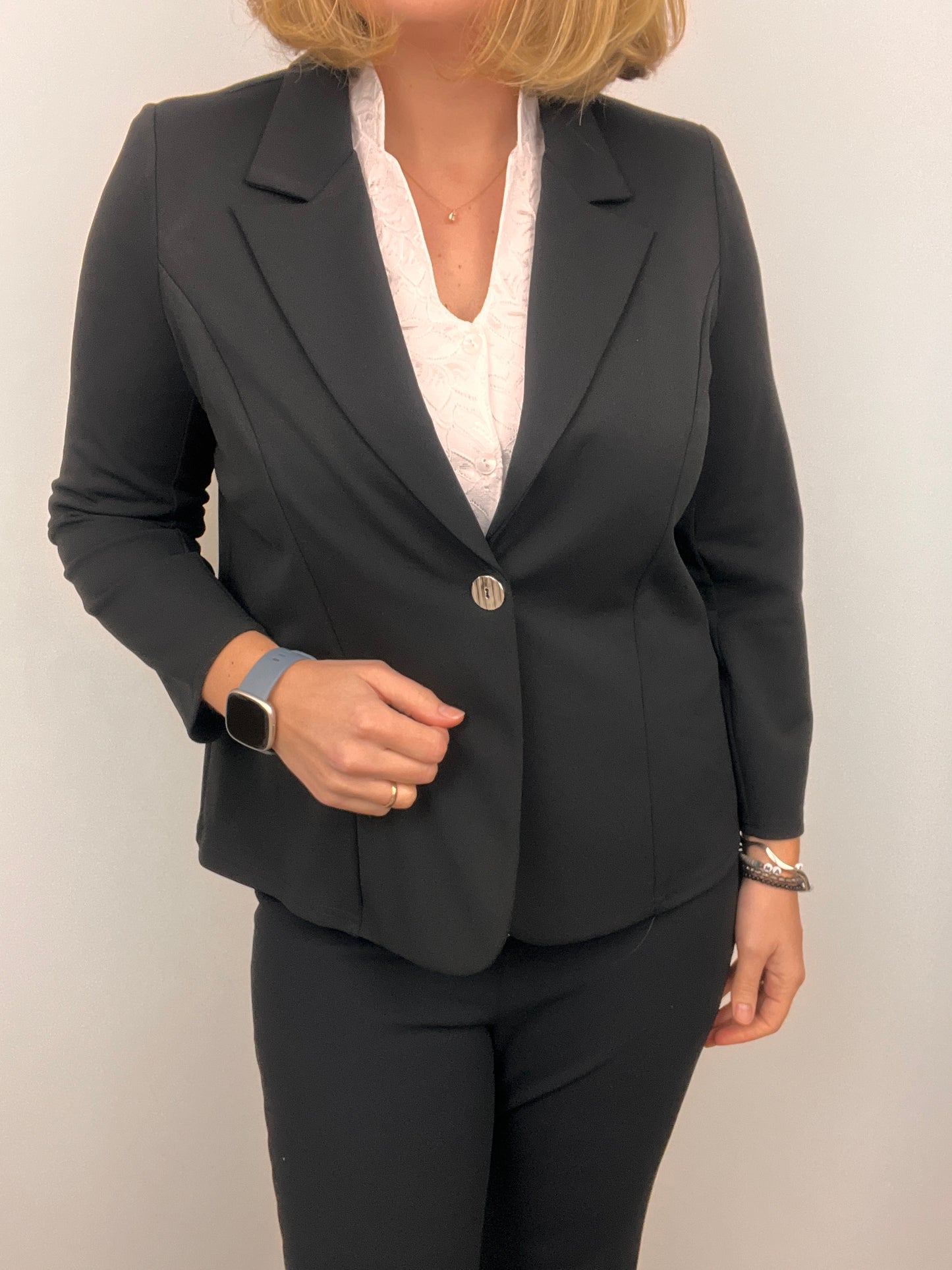Black fabric jacket with lapel collar