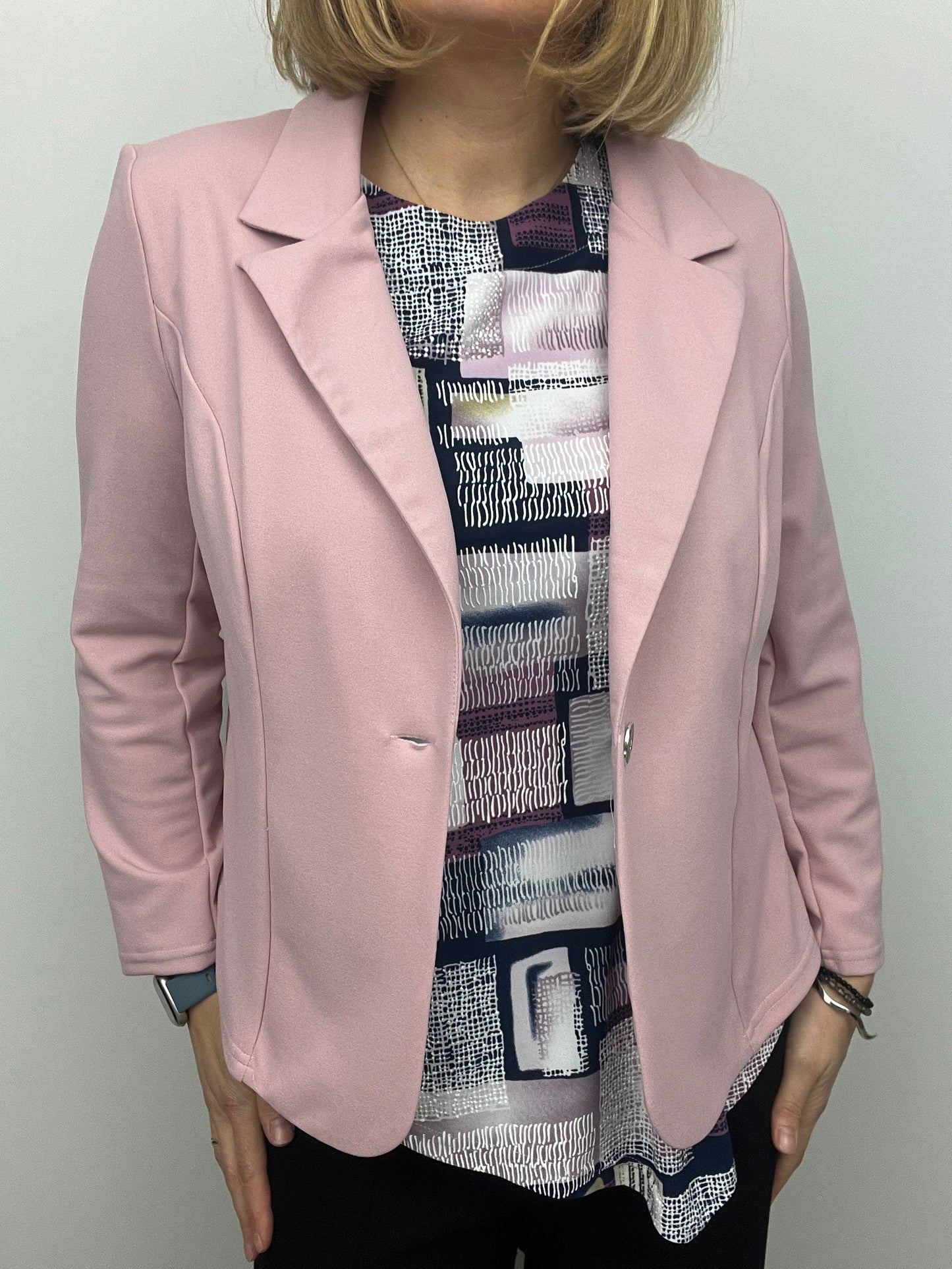 Soft pink fabric jacket with lapel collar