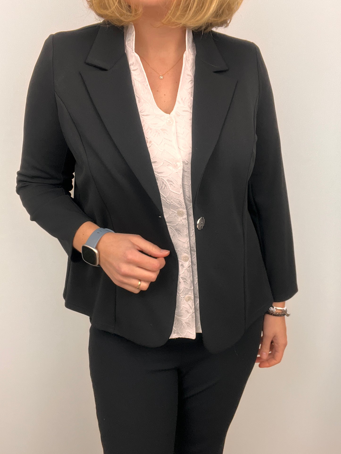 Black fabric jacket with lapel collar