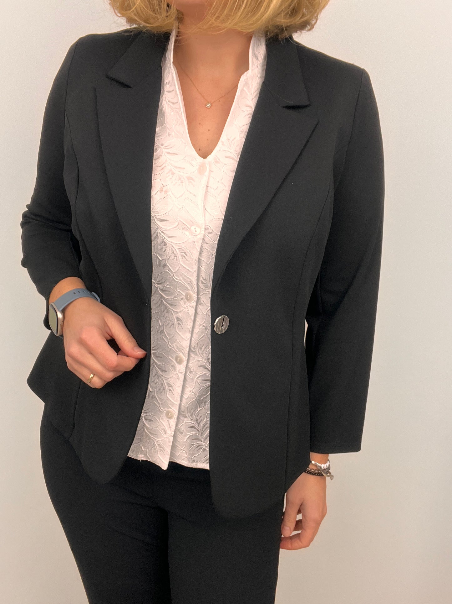 Black fabric jacket with lapel collar