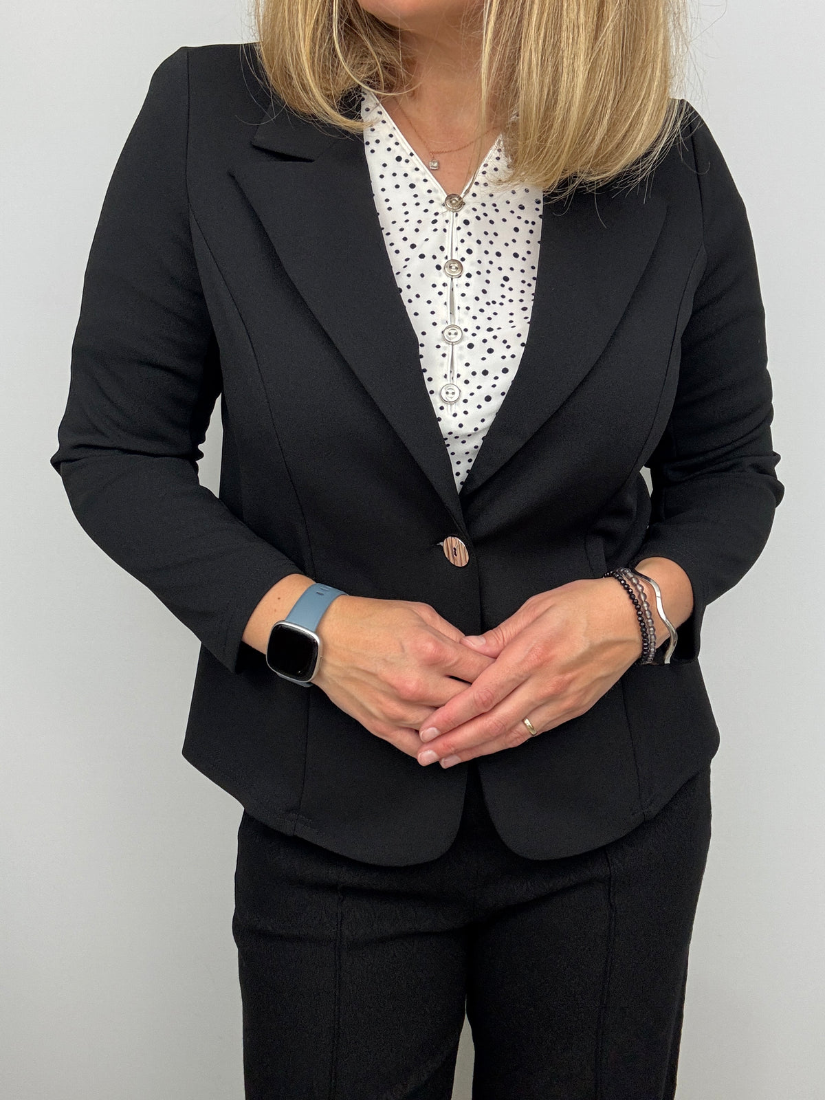 Black fabric jacket with lapel collar